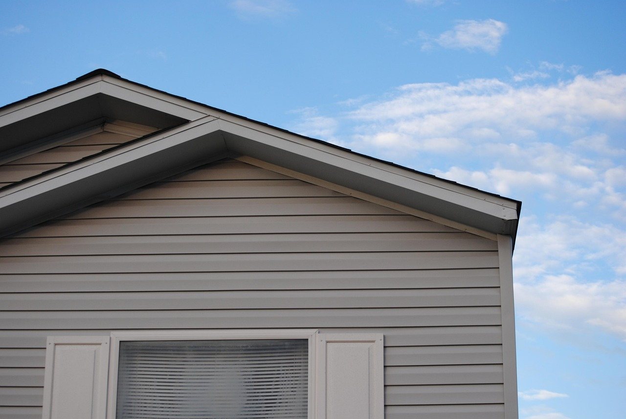 Grey lap siding and window trim detail