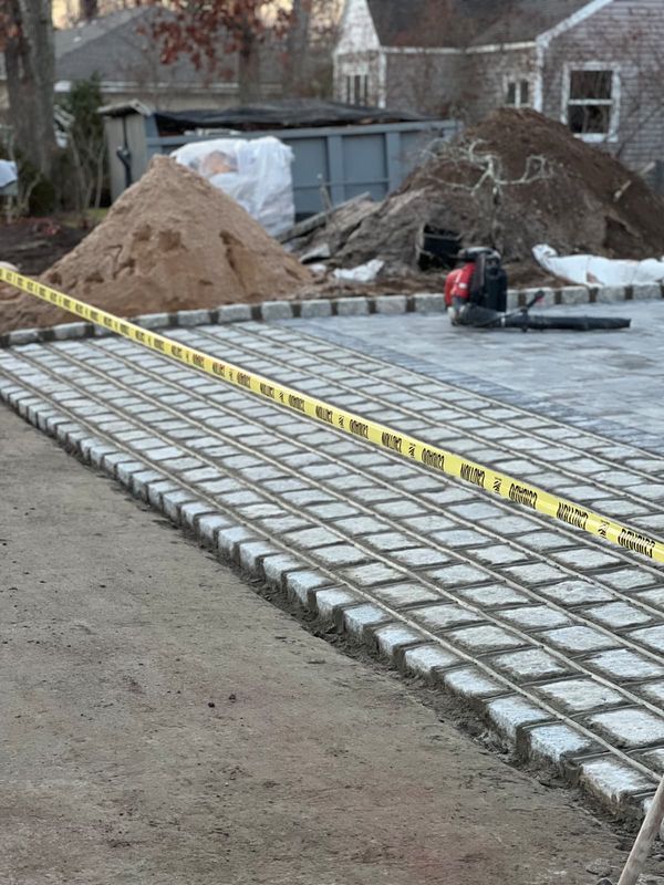 Cobbles set on a screeded sand bed by JDG Concrete & Construction