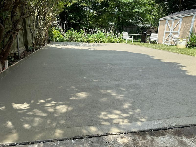 Broom-finished concrete pad, forms stripped by JDG Concrete & Construction