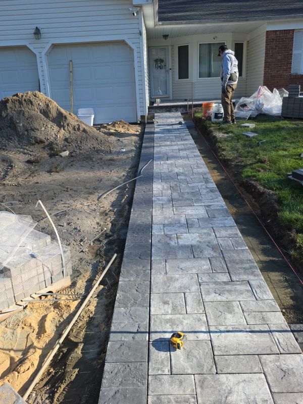 Front walkway along the garage, border set first by JDG Concrete & Construction