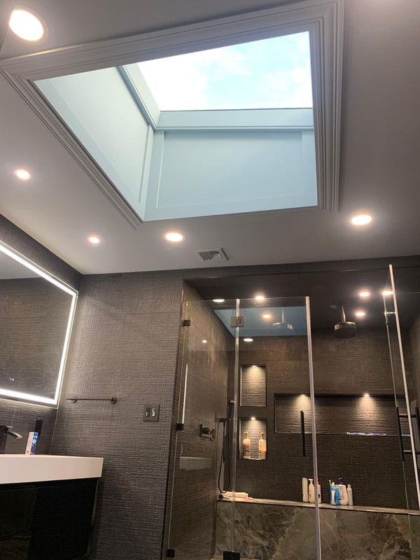Skylight over the master bath by JDG Concrete & Construction