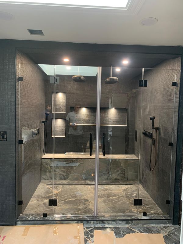 Shower enclosure from the doorway by JDG Concrete & Construction