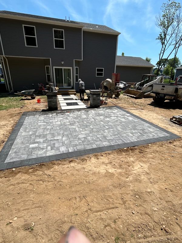 Patio base compacted, border set, field to come by JDG Concrete & Construction
