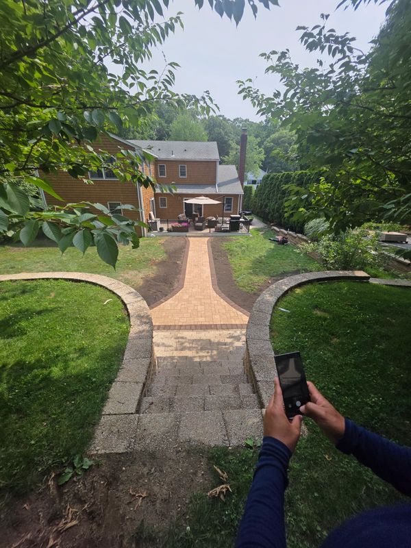 Walkway running up to the front entry by JDG Concrete & Construction
